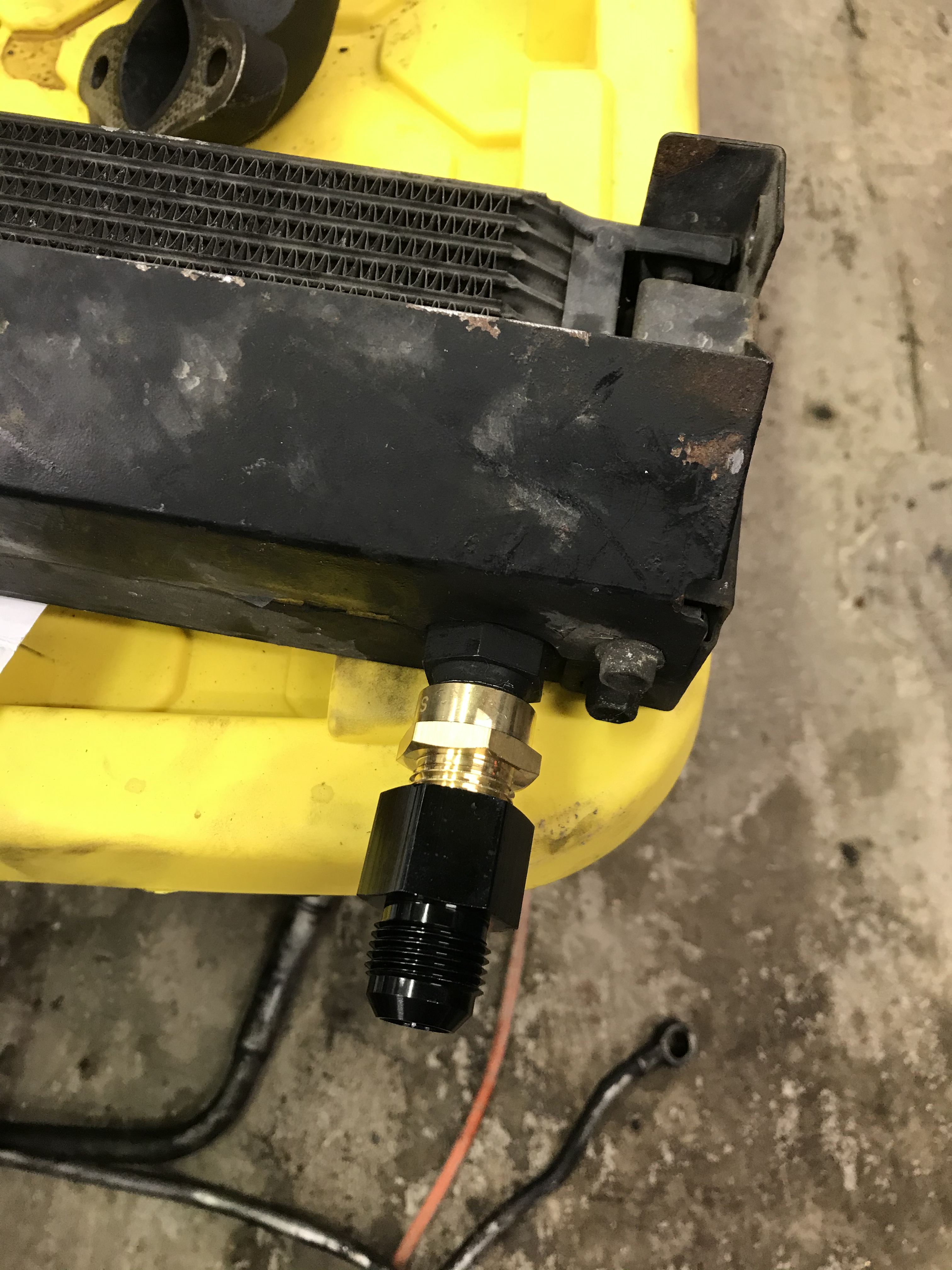 Multiple threaded fittings stacked on top of each other