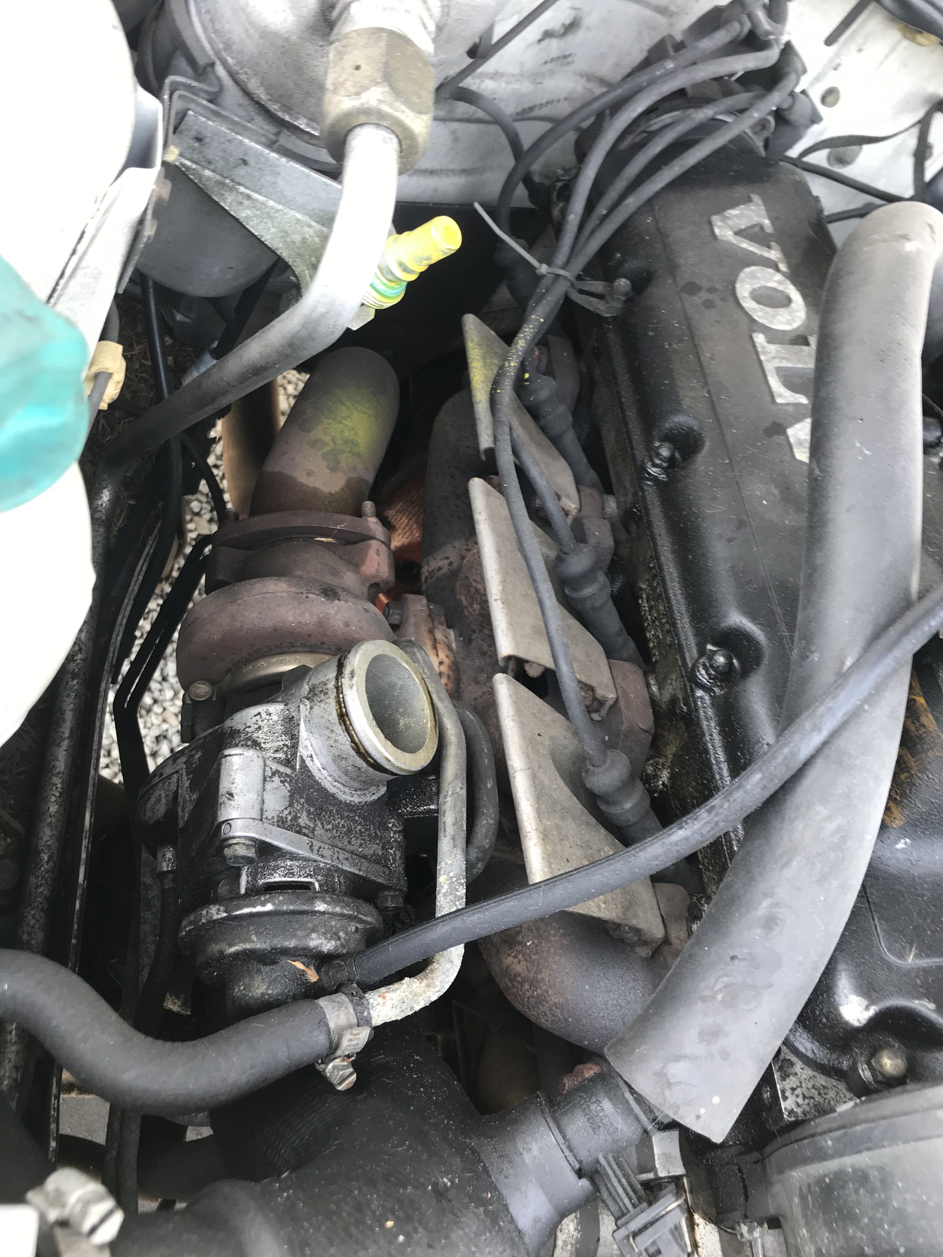 Turbocharger installed in an engine bay